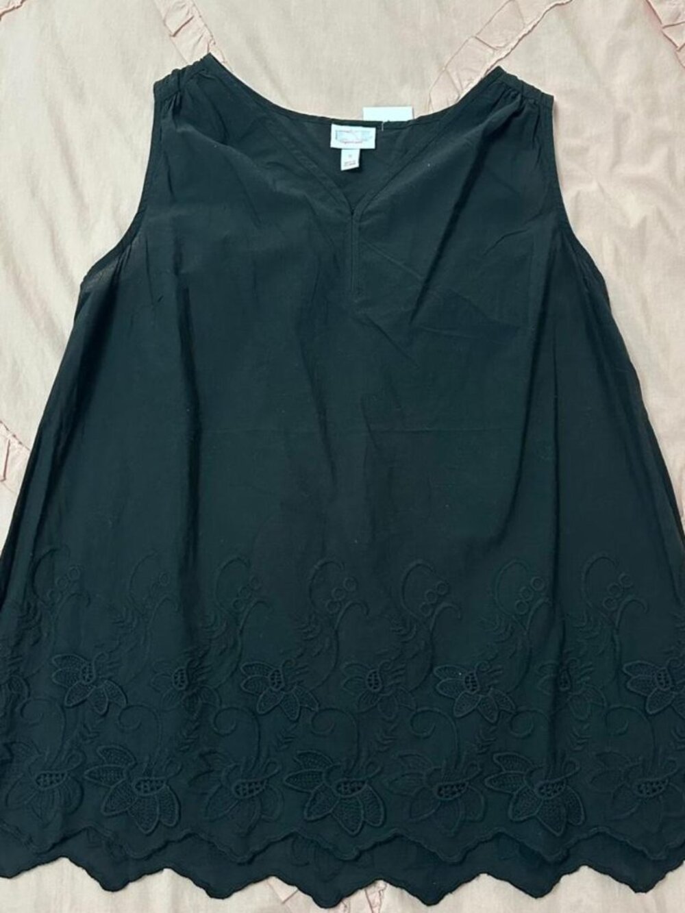 Ingrid & Isabel black maternity top with floral embroidery and scalloped hem.